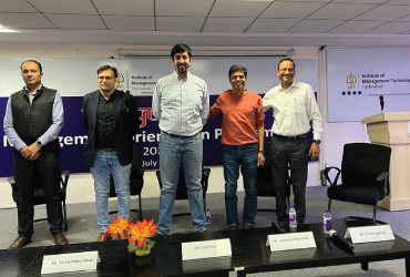 Speakers on stage at an industry event